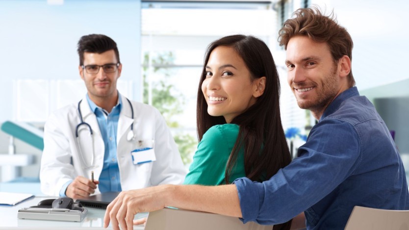 Young couple discussing about vasectomy with a specialist