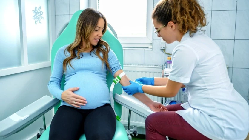 Pregnant woman having blood drawn