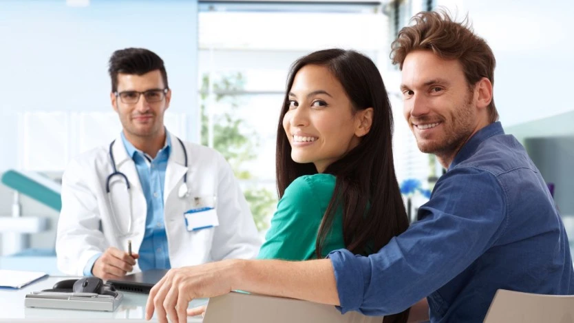 Young couple discussing about vasectomy with a specialist