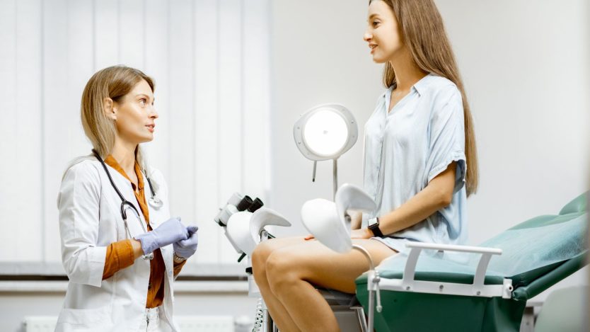 Gynaecologist with patient in consultation