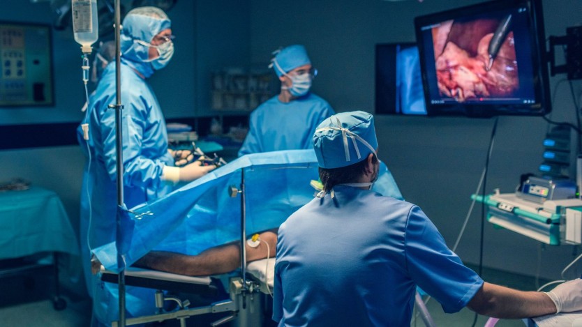 Surgeons in the midst of a surgical procedure