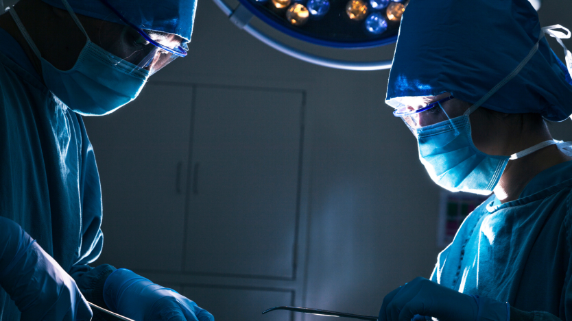Surgeons performing hip surgery