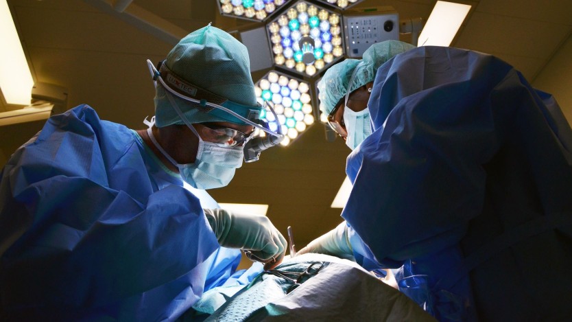 Surgeons performing hip surgery