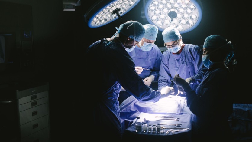 Surgeons performing a knee replacement surgery